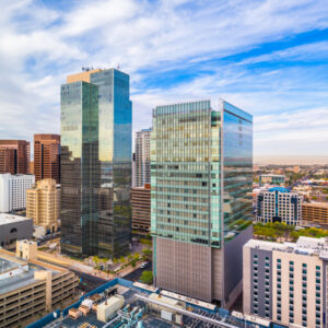 A realistic depiction of Phoenix cityscape highlighting local SEO landmarks with detailed buildings and natural surroundings.